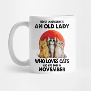 Never Underestimate An Old Lady Who Loves Cats And Was Born In November Mug